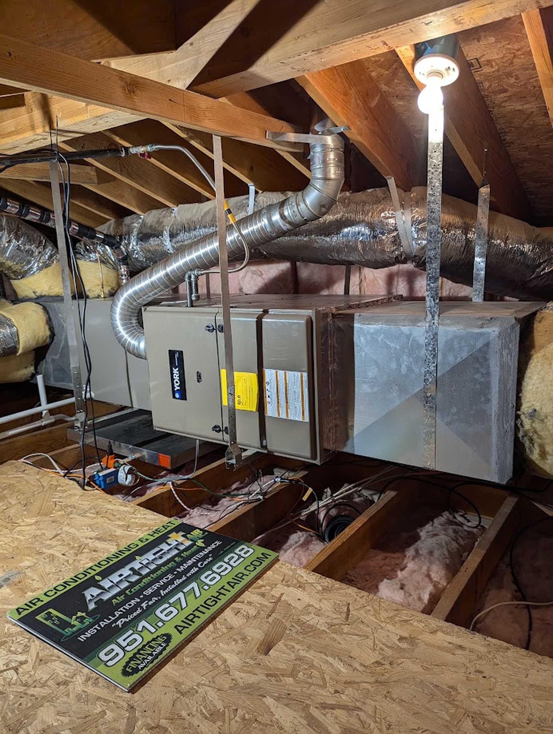 A York-branded high-efficiency AC unit installed in an attic space