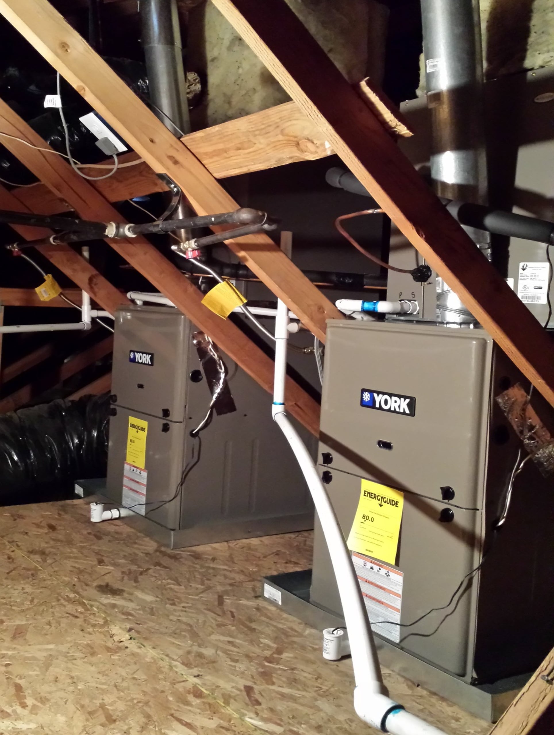 A York-branded high-efficiency AC unit installed in an attic space